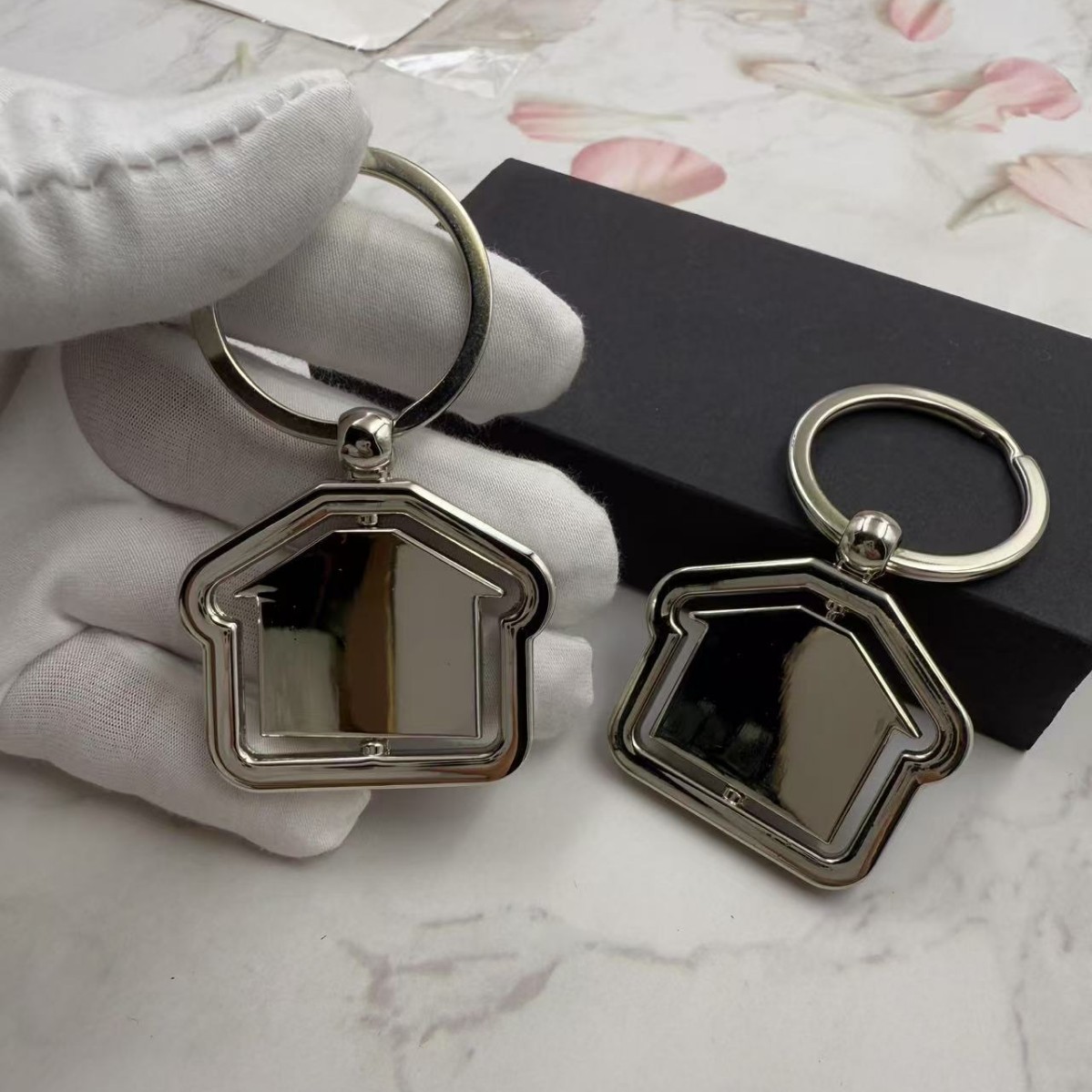 Rotating House Metal Keychain