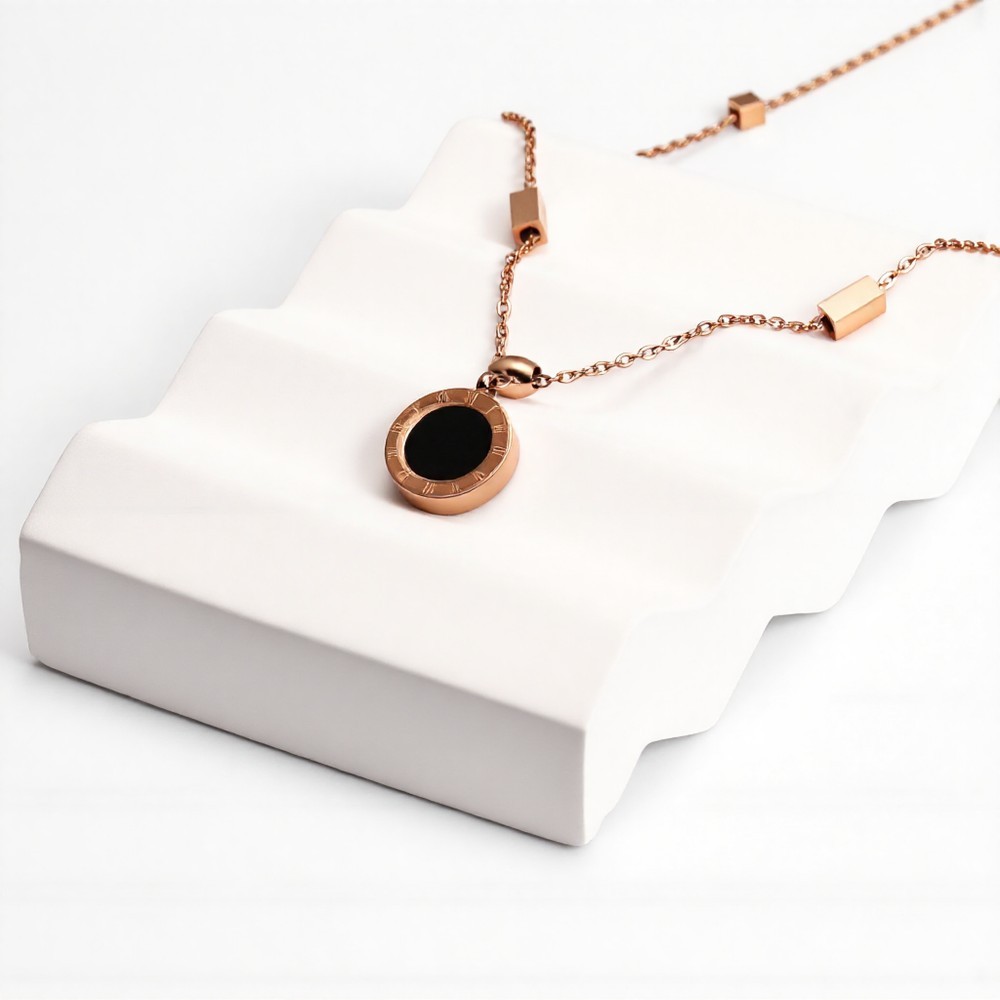 Rose gold Roman numeral two-tone black and white disc pendant necklace
