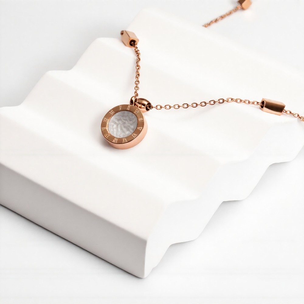 Rose gold Roman numeral two-tone black and white disc pendant necklace