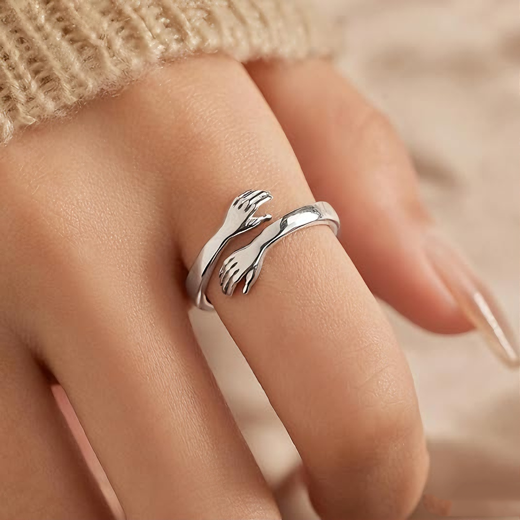 Embrace the engraved ring with both hands