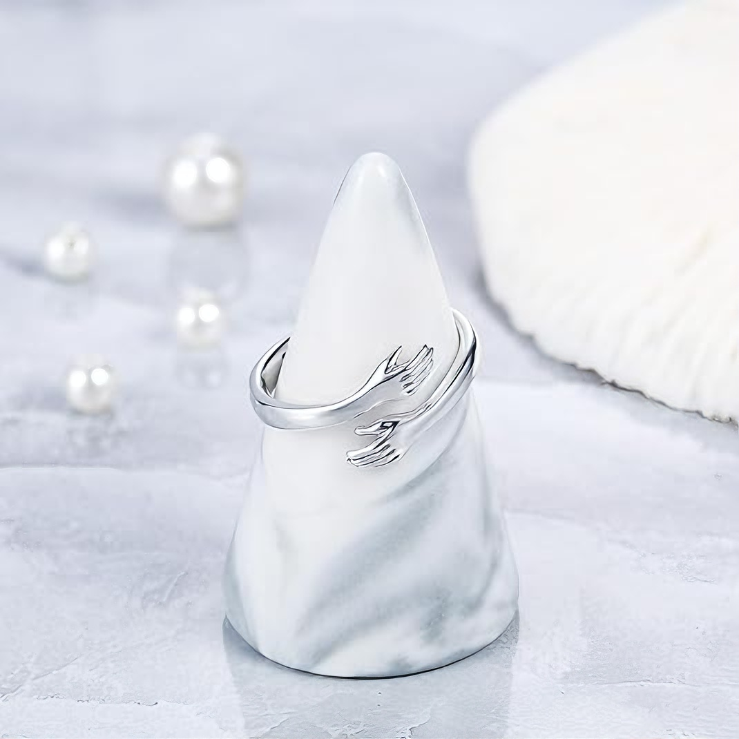 Embrace the engraved ring with both hands