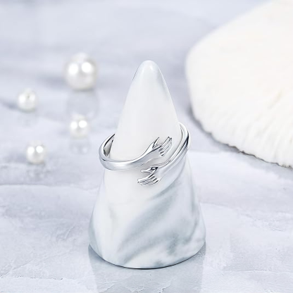 Embrace the engraved ring with both hands