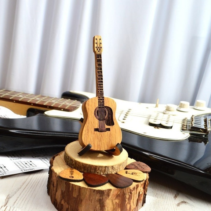 Wooden guitar shaped pick with stand