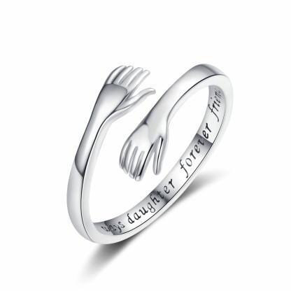 Embrace the engraved ring with both hands