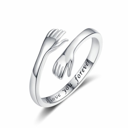 Embrace the engraved ring with both hands