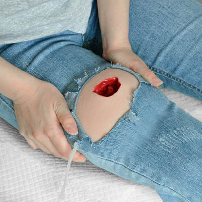 wearable wound trainer for bleeding simulation and packing training