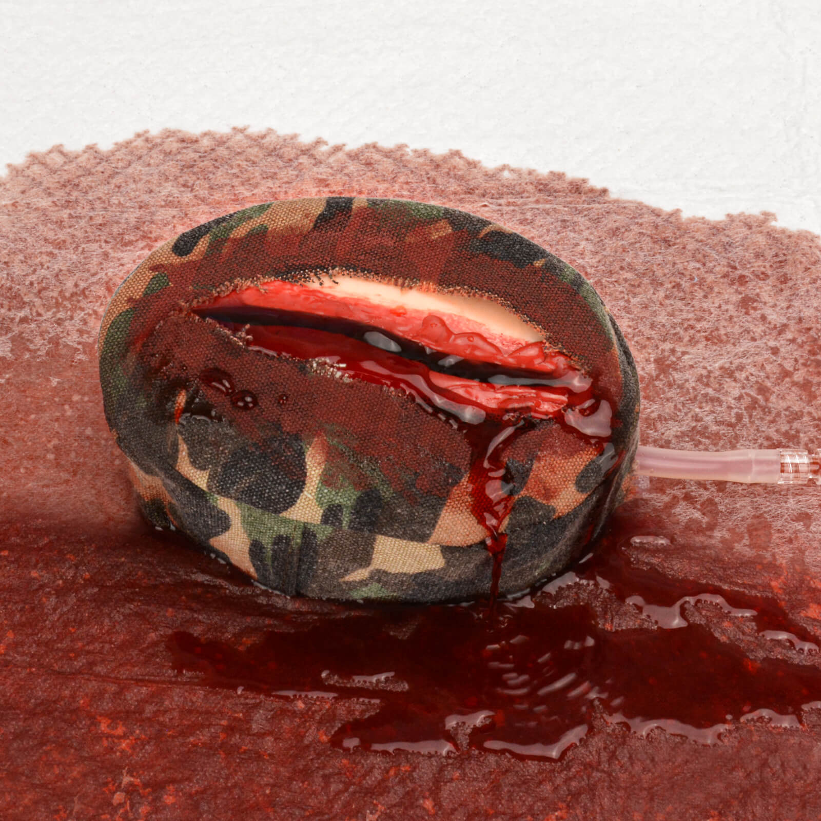 Covered Incision Wound Bleeding Control Trainer with Bleeding Simulation