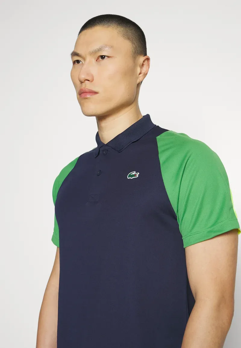 TENNIS - Polo - bleu marine/vert/jaune