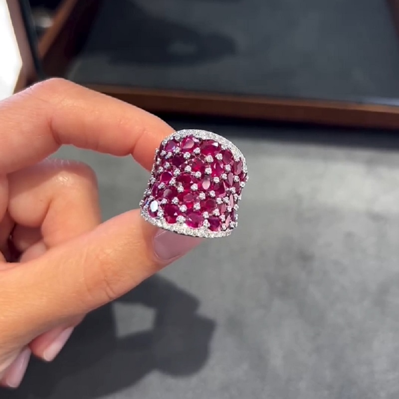 25.5CT Oval Shaped Ruby Saddle Ring with Diamond Prongs