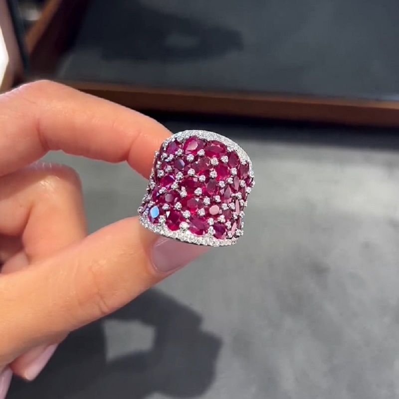 25.5CT Oval Shaped Ruby Saddle Ring with Diamond Prongs