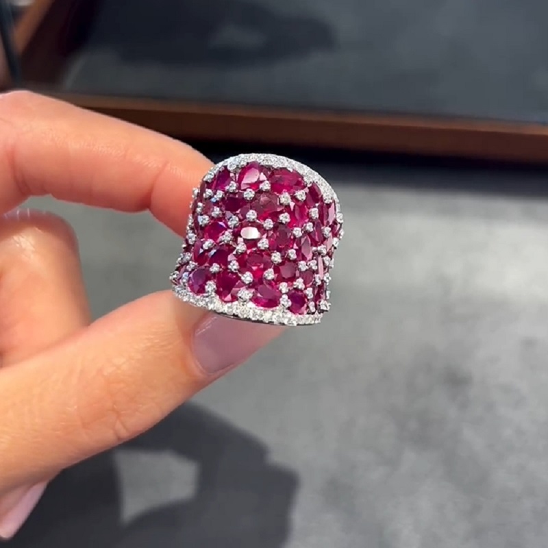 25.5CT Oval Shaped Ruby Saddle Ring with Diamond Prongs