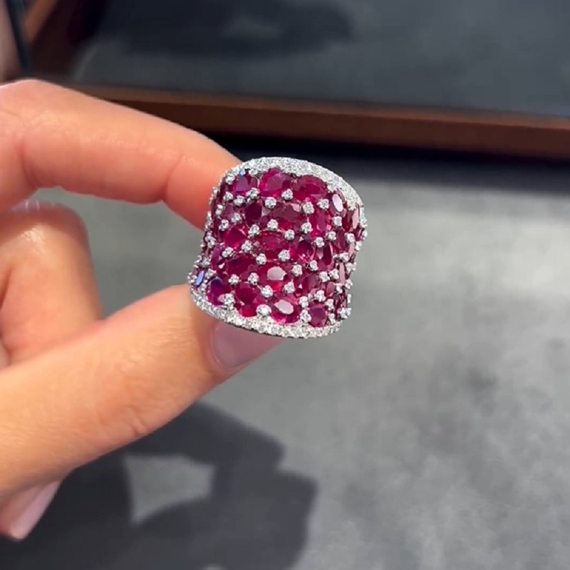 25.5CT Oval Shaped Ruby Saddle Ring with Diamond Prongs