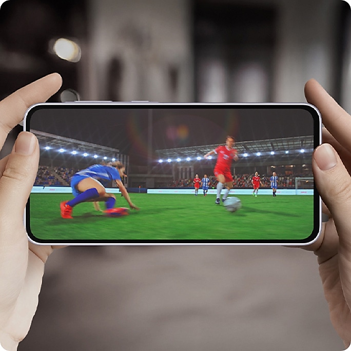 Text Octa Core can be seen. The screen zooms out showing the Octa Core text onscreen with a person holding Galaxy A36 5G horizontally. The screen then switches to a video of a soccer match. 