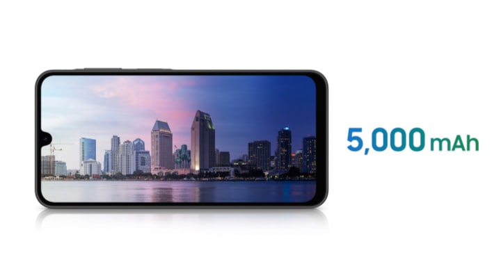 A Galaxy A26 5G device displaying a cityscape by the river, with the left half in daytime and the right half at night. Nearby are the texts Watch up to 17 hrs and 5,000 mAh.