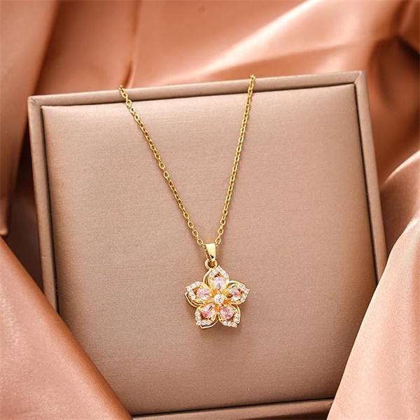 Niche, accessible luxury, trendy rotating Bauhinia flower zircon pendant necklace.