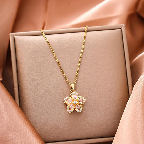 Niche, accessible luxury, trendy rotating Bauhinia flower zircon pendant necklace.