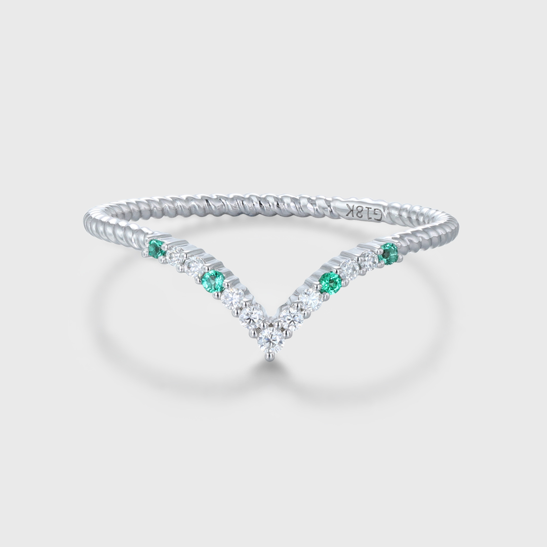 oveela 14K white gold curved wedding band featuring emerald and diamond accents, handcrafted for bridal or anniversary wear.