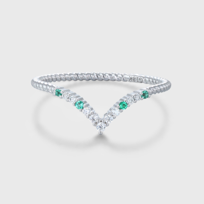 oveela 14K white gold curved wedding band featuring emerald and diamond accents, handcrafted for bridal or anniversary wear.