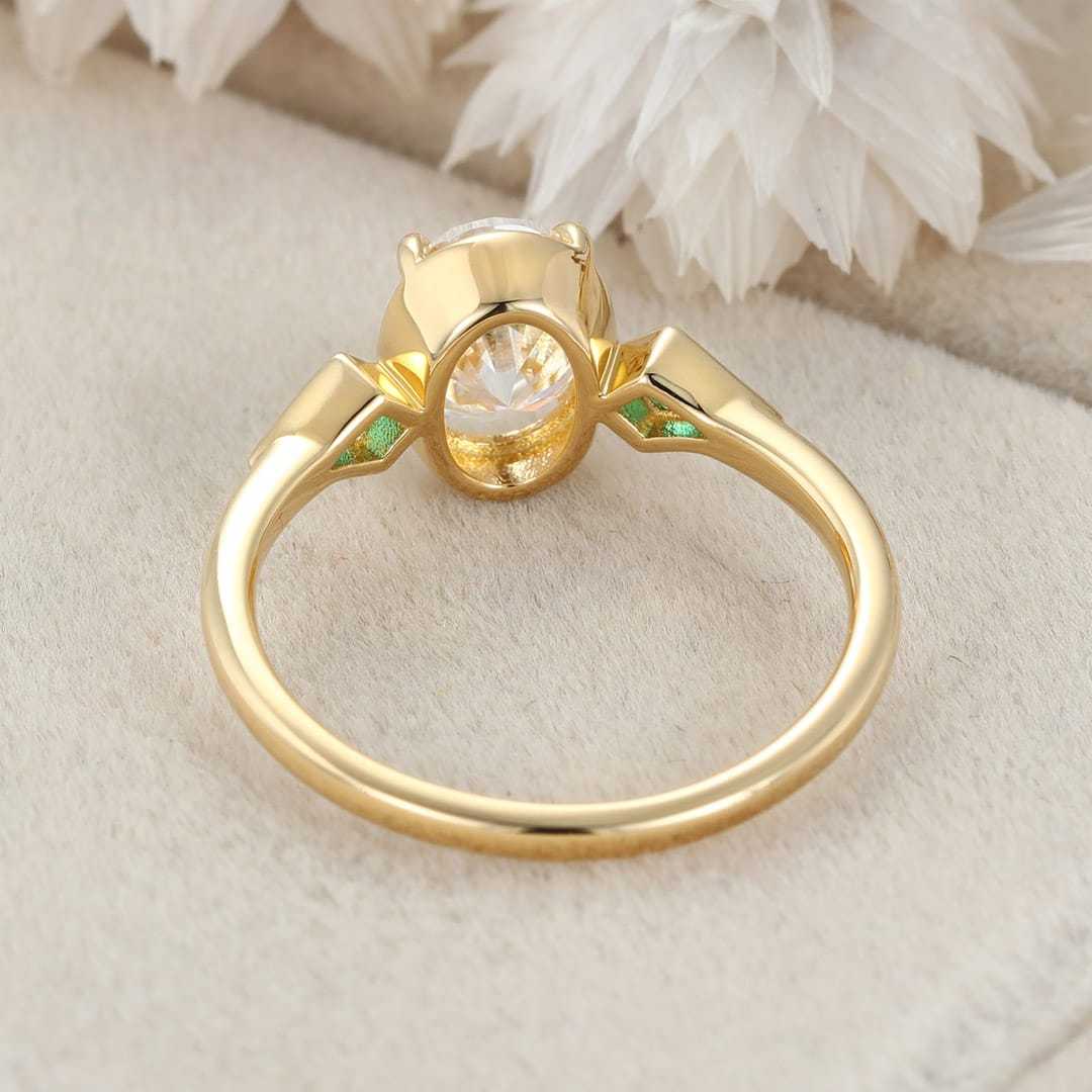 Bezel Set Oval Cut Moissanite Engagement Ring Unique 14K Yellow Gold Lab Emerald Side Stone Ring Delicate Wedding Ring