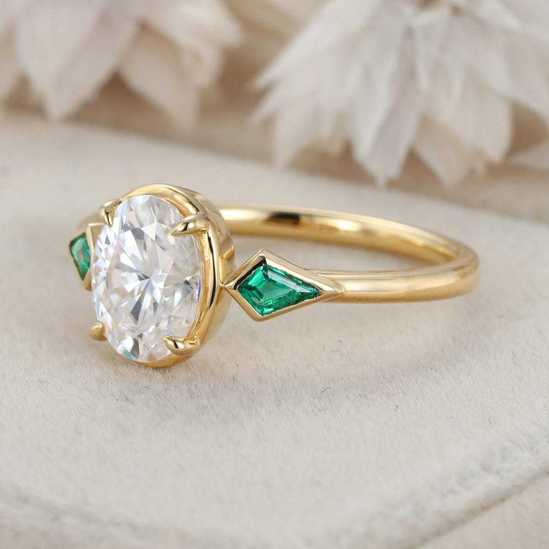 Bezel Set Oval Cut Moissanite Engagement Ring Unique 14K Yellow Gold Lab Emerald Side Stone Ring Delicate Wedding Ring