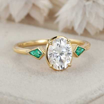 Bezel Set Oval Cut Moissanite Engagement Ring Unique 14K Yellow Gold Lab Emerald Side Stone Ring Delicate Wedding Ring