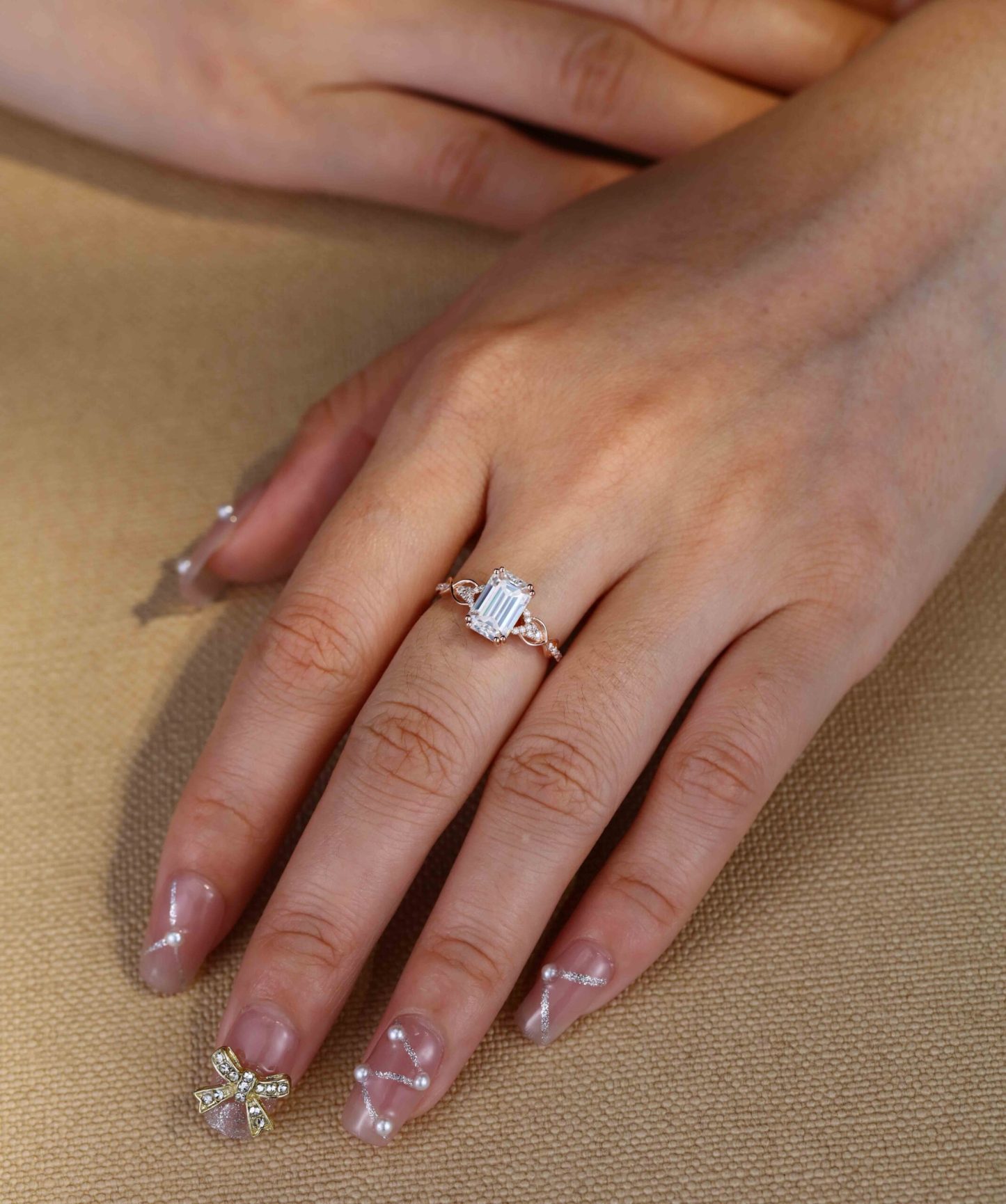 2 Carat Emerald Cut Moissanite Twist Engagement Ring In 14k Rose Gold