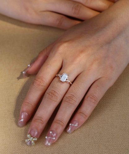 2 Carat Emerald Cut Moissanite Twist Engagement Ring In 14k Rose Gold
