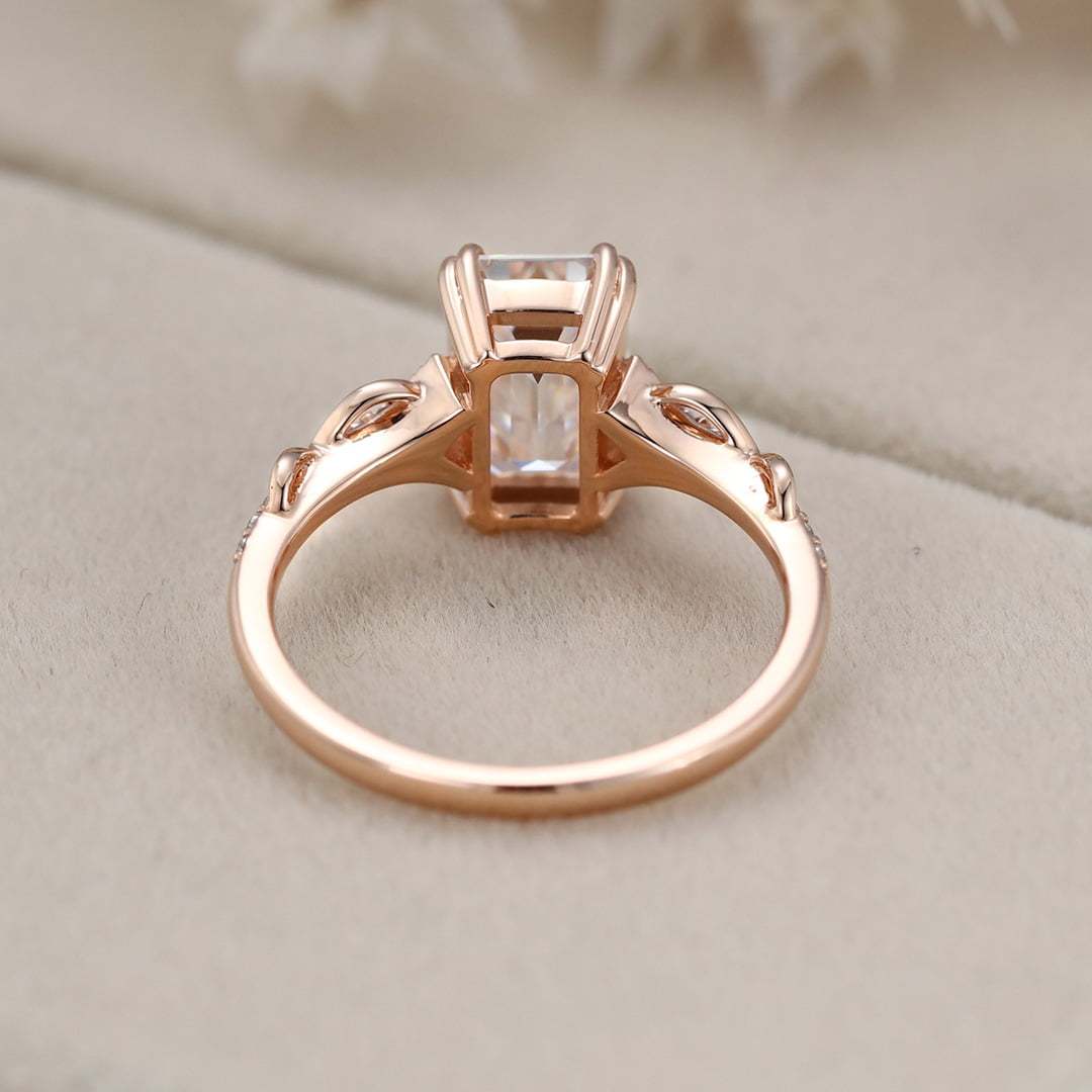 2 Carat Emerald Cut Moissanite Twist Engagement Ring In 14k Rose Gold