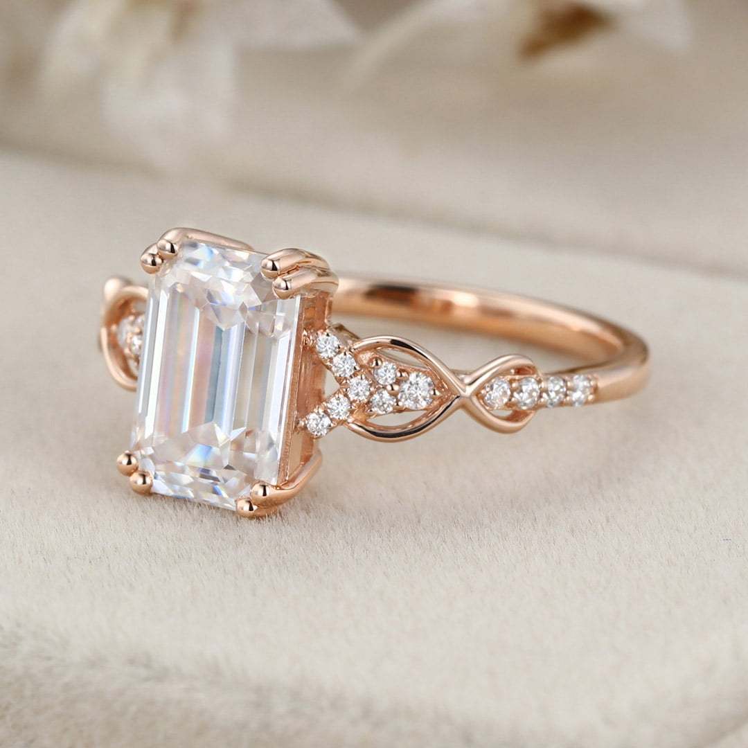 2 Carat Emerald Cut Moissanite Twist Engagement Ring In 14k Rose Gold