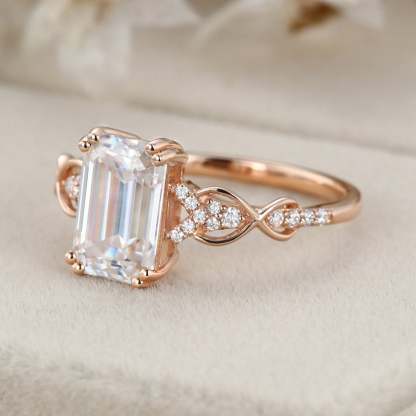 2 Carat Emerald Cut Moissanite Twist Engagement Ring In 14k Rose Gold