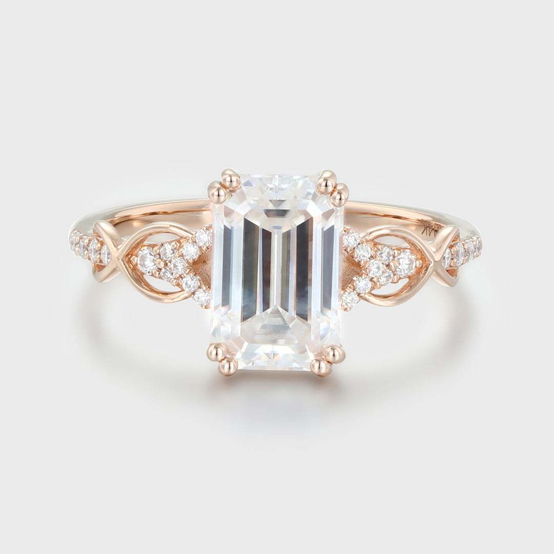2 Carat Emerald Cut Moissanite Twist Engagement Ring In 14k Rose Gold