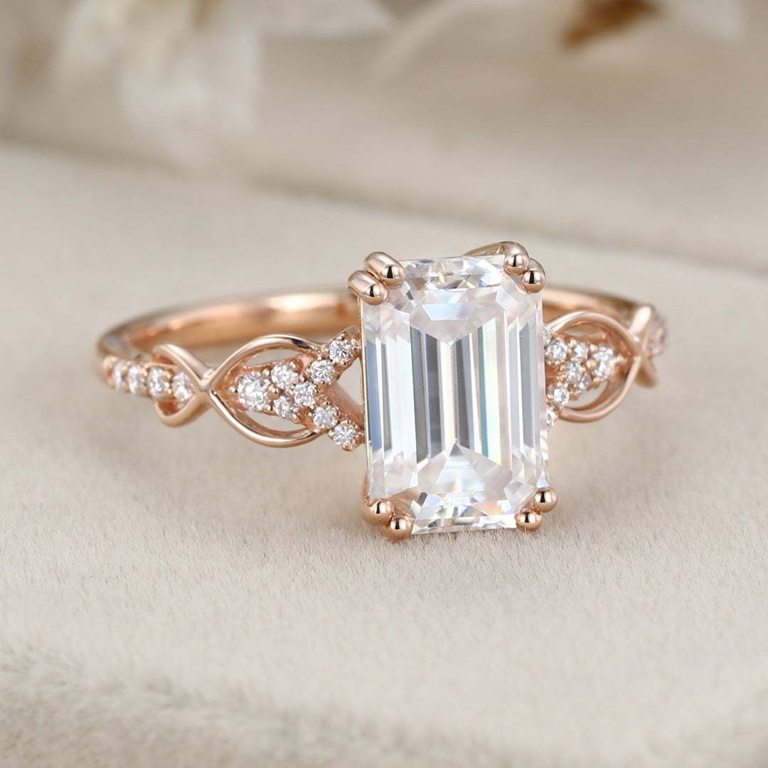 2 Carat Emerald Cut Moissanite Twist Engagement Ring In 14k Rose Gold