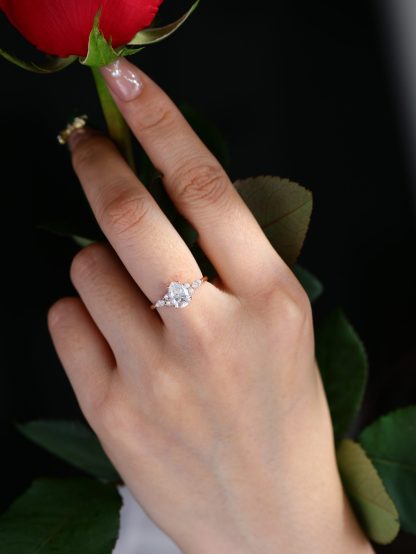 1.5 Carat Pear Shaped Moissanite Engagement Ring In 14K Rose Gold