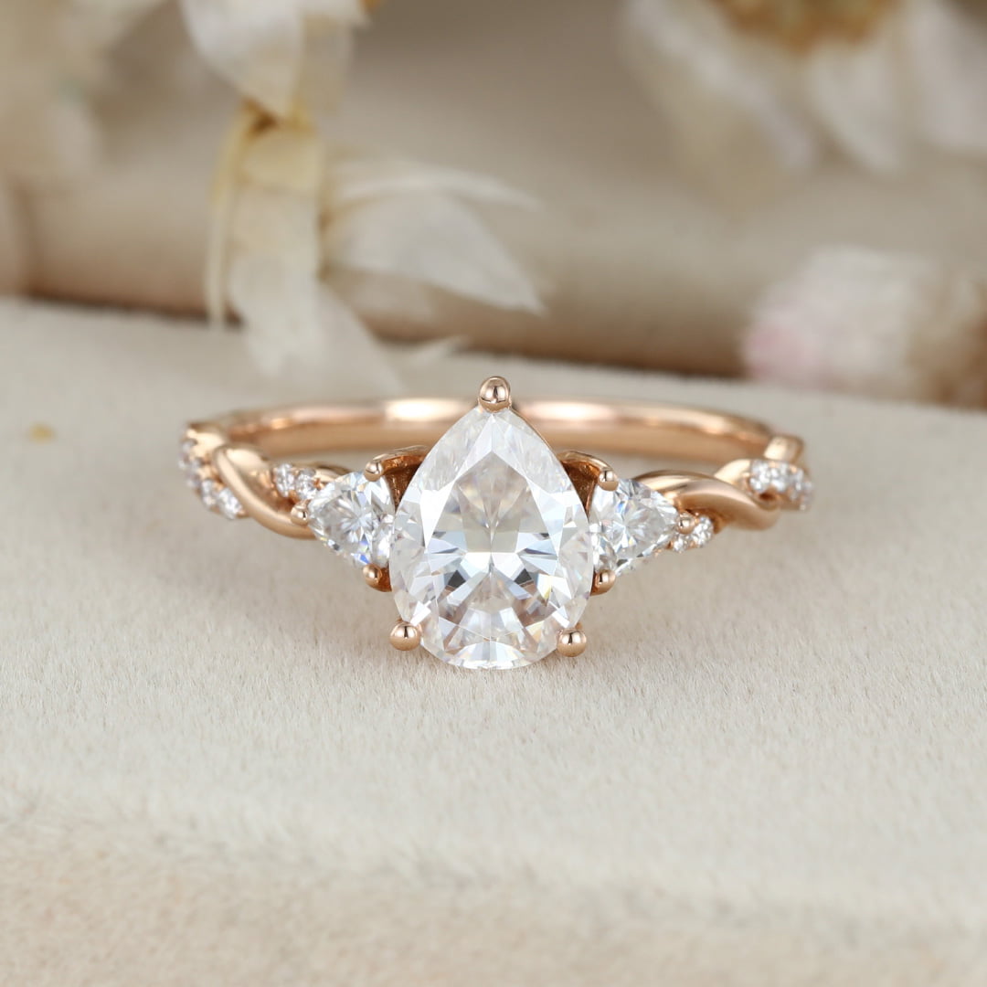 1.5 Carat Pear Shape Moissanite Twist Engagement Ring In 14K Rose Gold