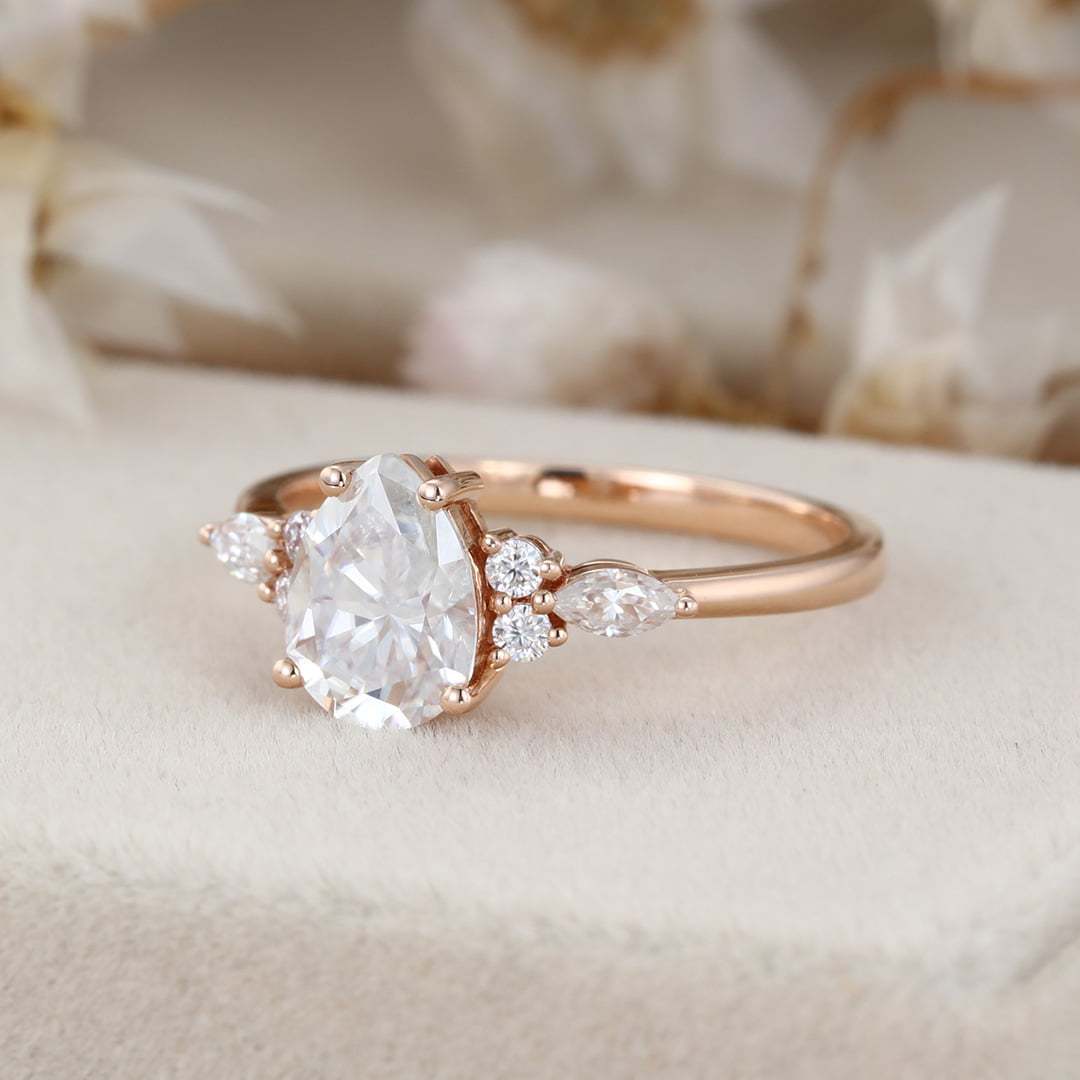 1.5 Carat Pear Shaped Moissanite Engagement Ring In 14K Rose Gold