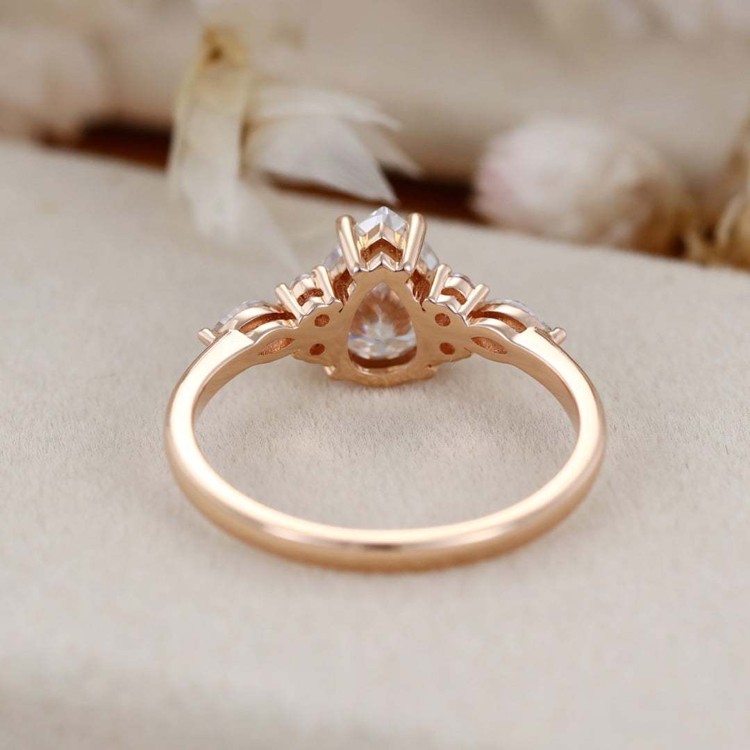 1.5 Carat Pear Shaped Moissanite Engagement Ring In 14K Rose Gold
