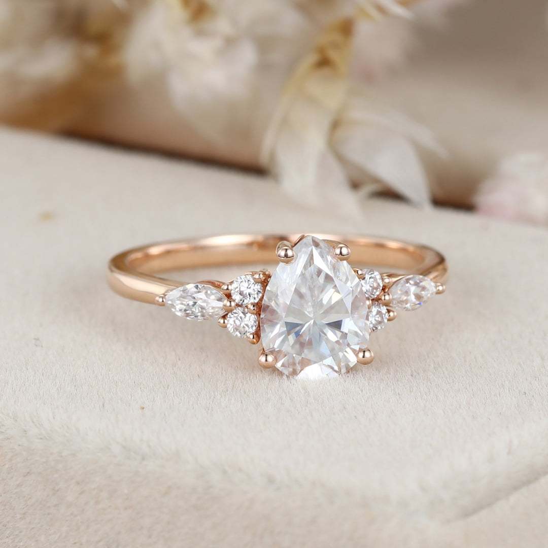 1.5 Carat Pear Shaped Moissanite Engagement Ring In 14K Rose Gold
