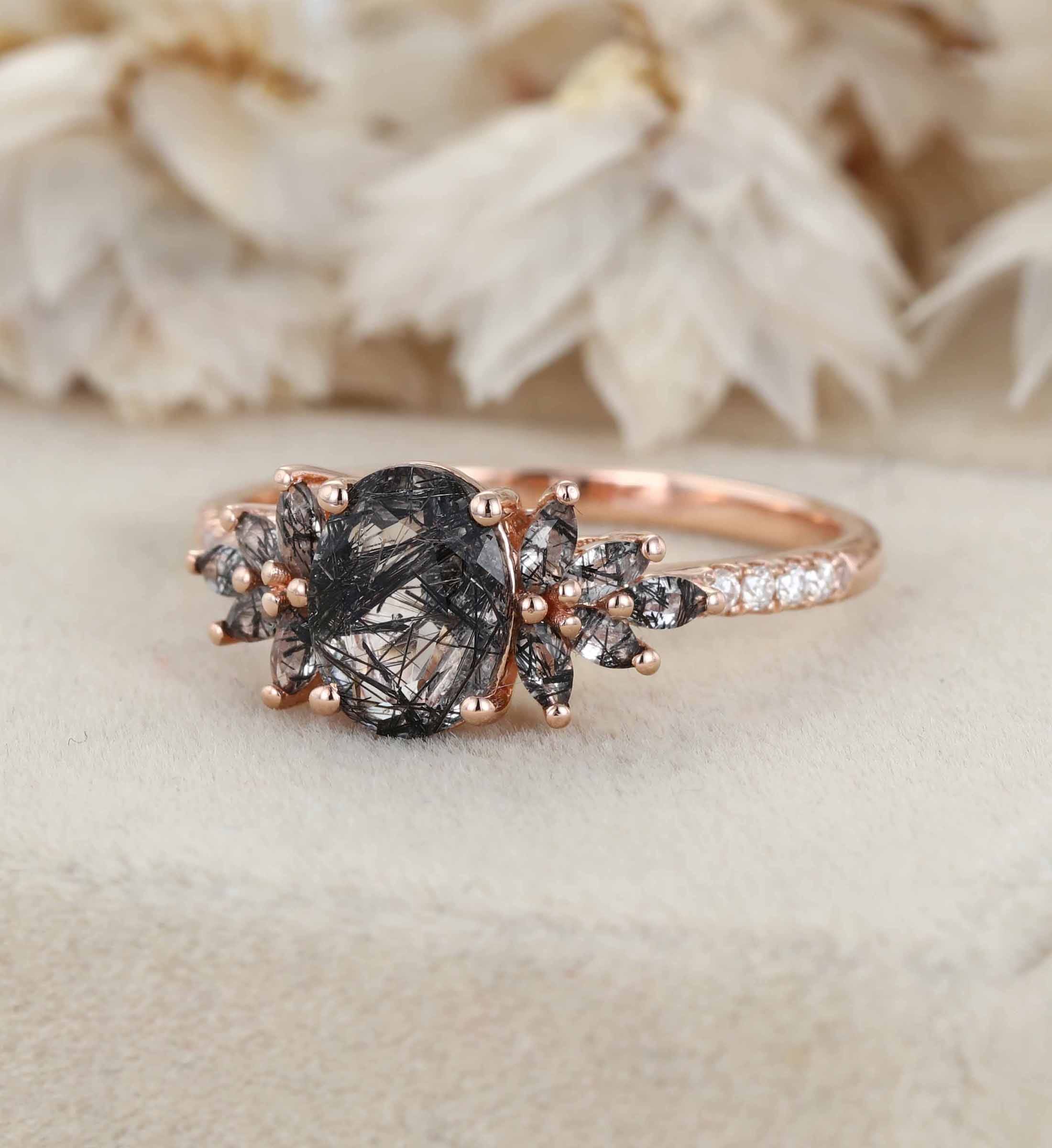 oval black diamond engagement ring