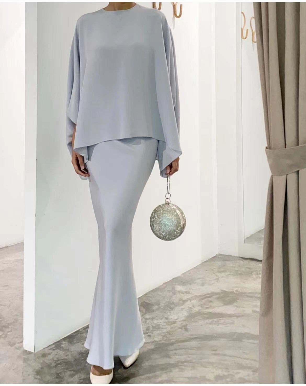 Fashionable solid color irregular top and skirt suit