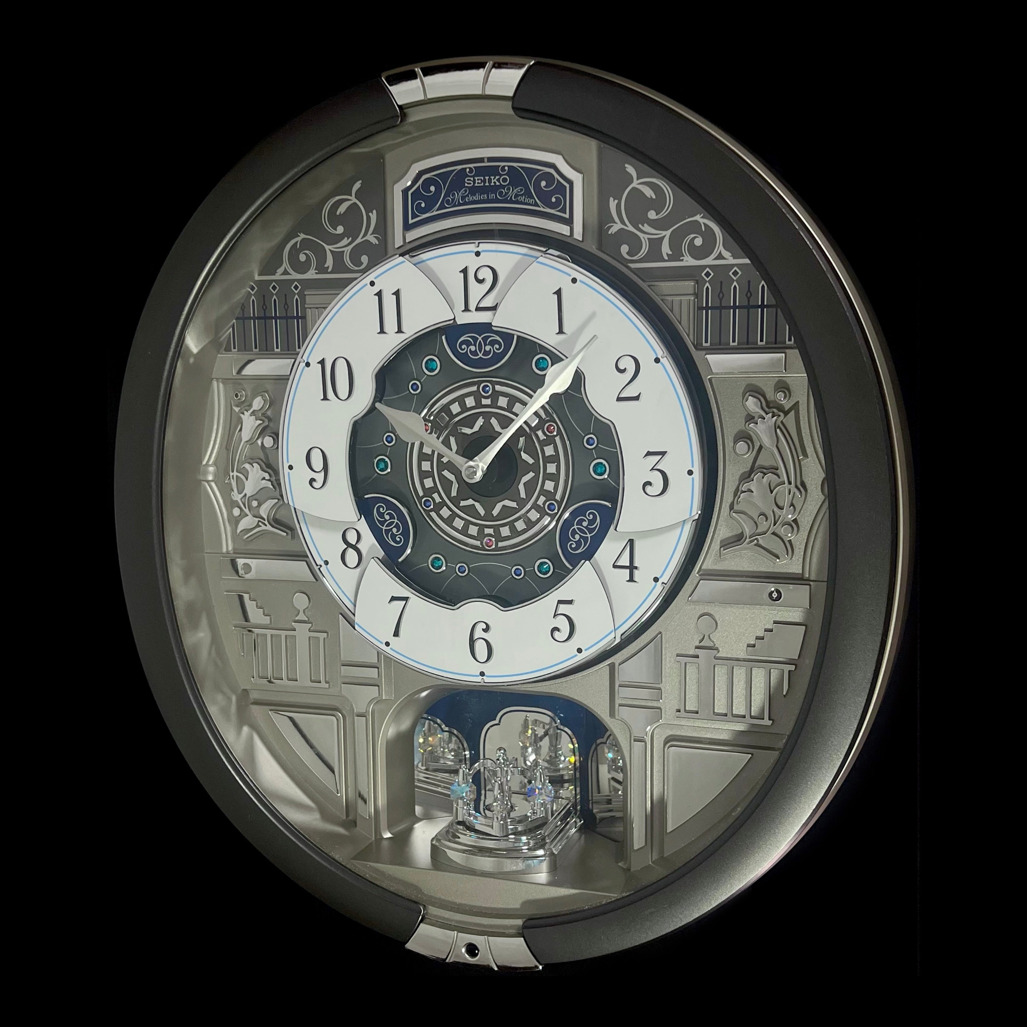 “Musical Motifs” Melodies in Motion Dancing Dial Musical Wall Clock