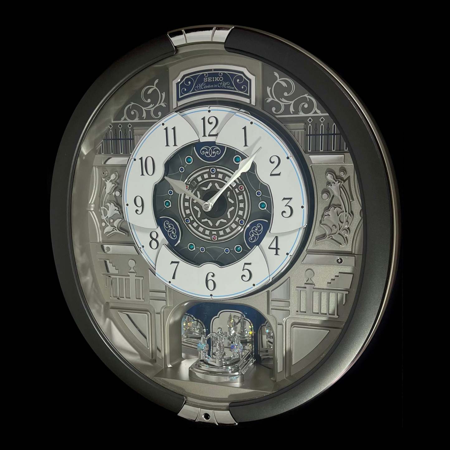 “Musical Motifs” Melodies in Motion Dancing Dial Musical Wall Clock