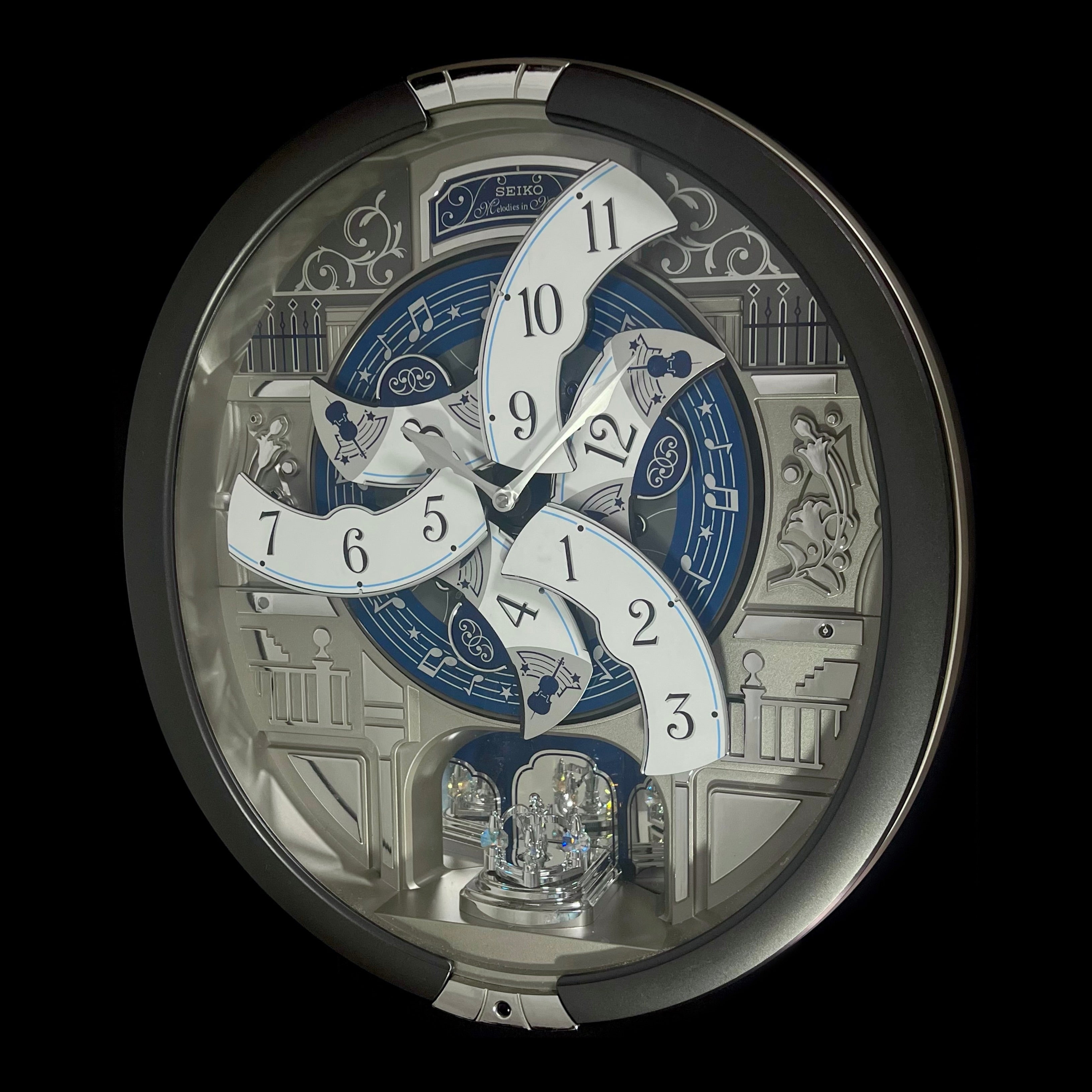 “Musical Motifs” Melodies in Motion Dancing Dial Musical Wall Clock