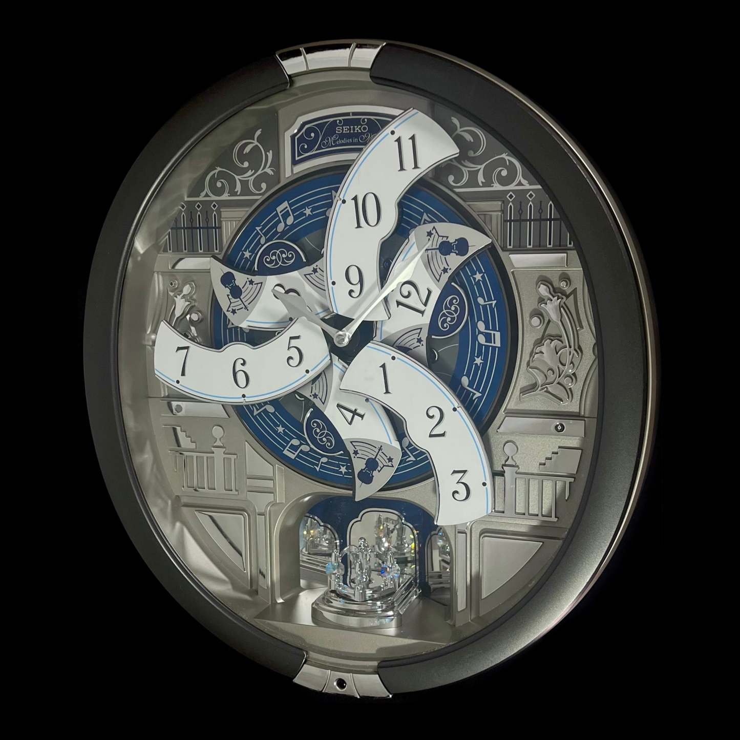 “Musical Motifs” Melodies in Motion Dancing Dial Musical Wall Clock