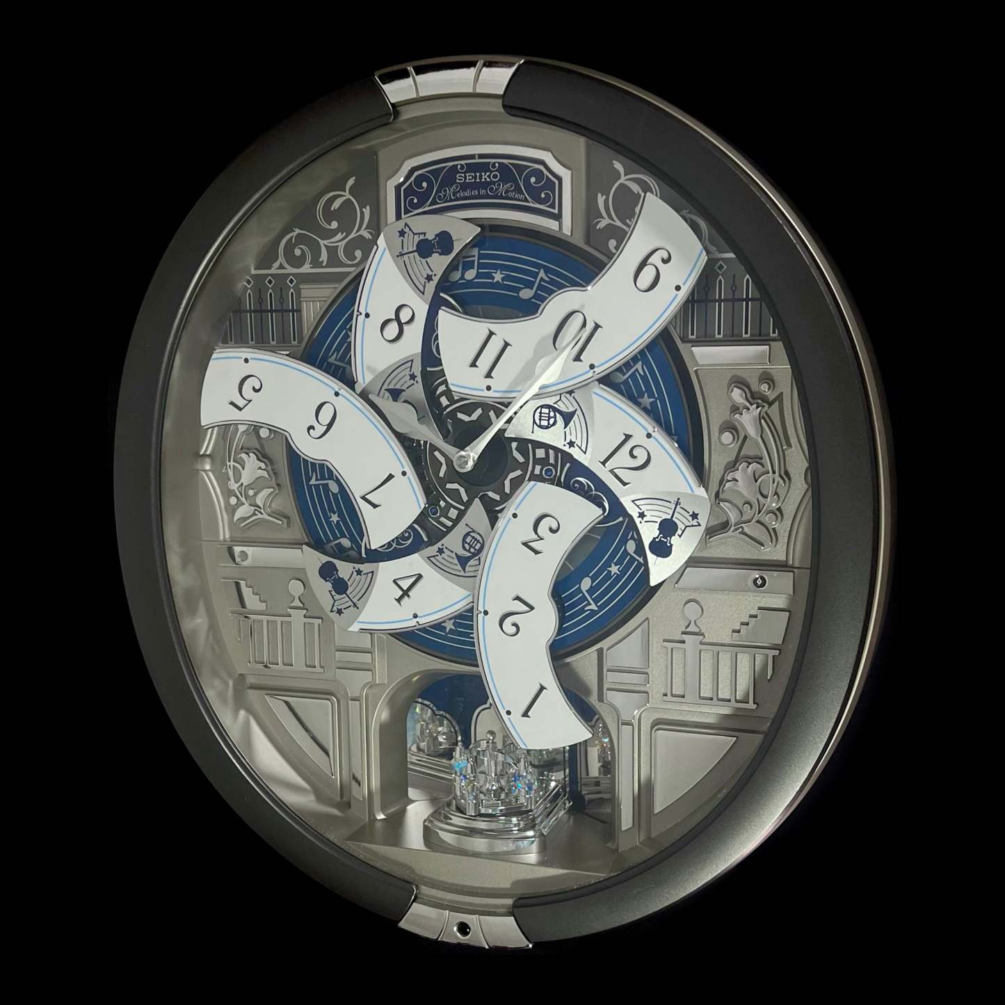 “Musical Motifs” Melodies in Motion Dancing Dial Musical Wall Clock