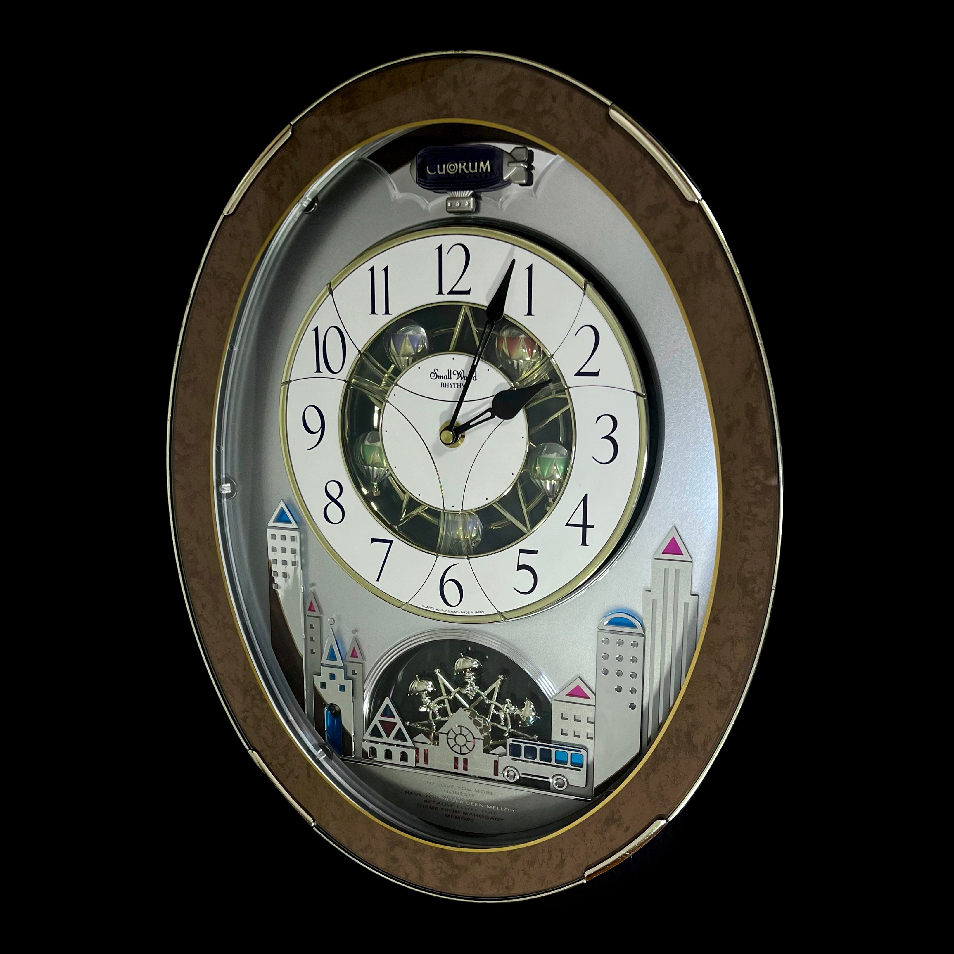 Rhythm “Tri-Cracker” Magic Motion Musical Wall Clock with Moving Dial and Balloons