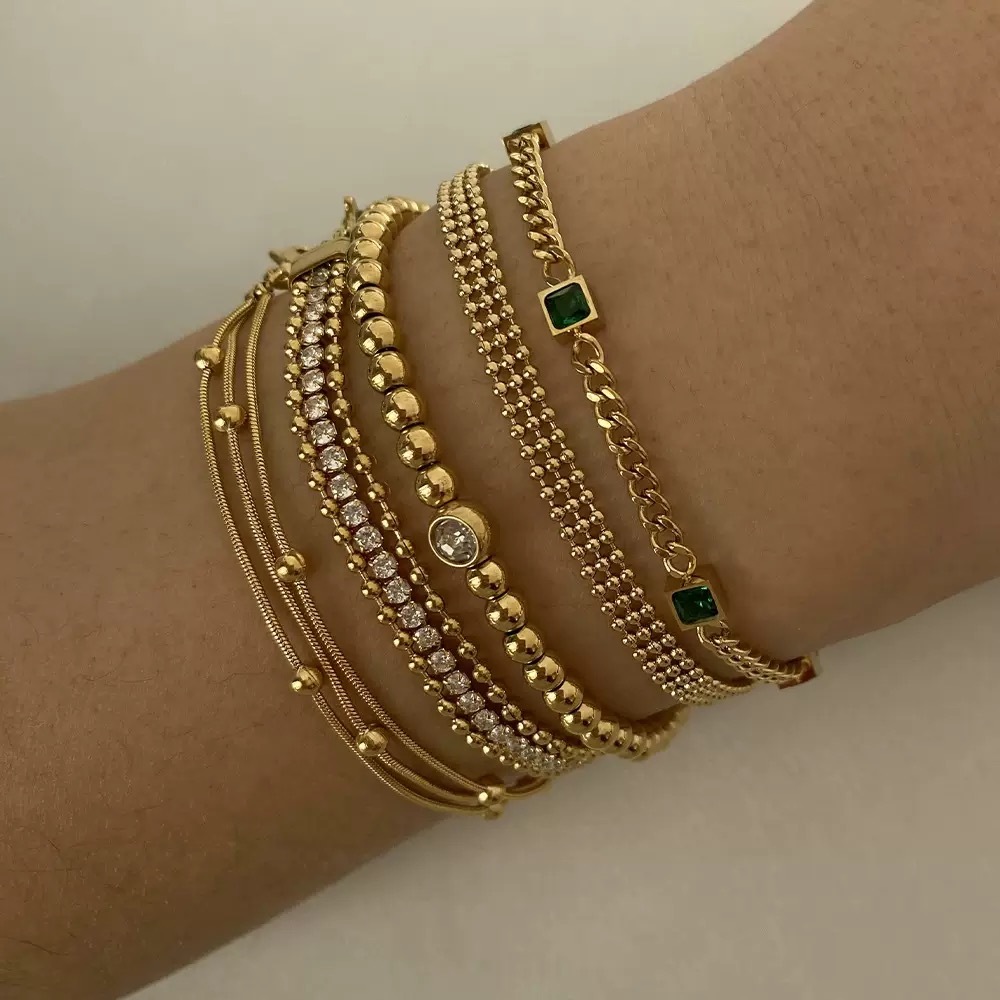 Gold-plated bracelet, emerald gemstones, women's jewelry, fashion accessory, luxury bracelet