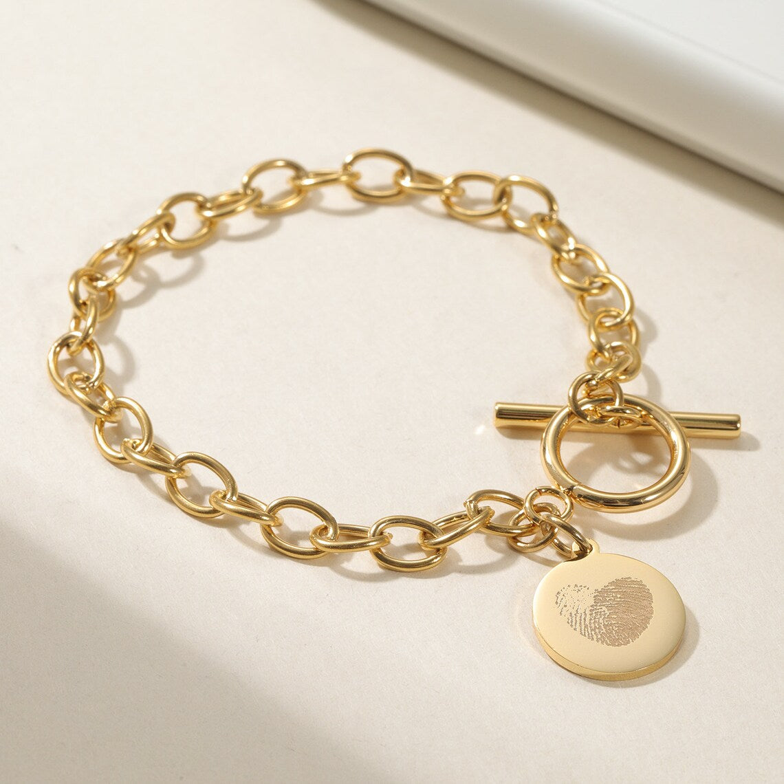 Cherish Life's Moments - Gold-Tone Fingerprint Bracelet, a Personal Touch. #FingerprintBracelet #GoldJewelry #PersonalizedGift