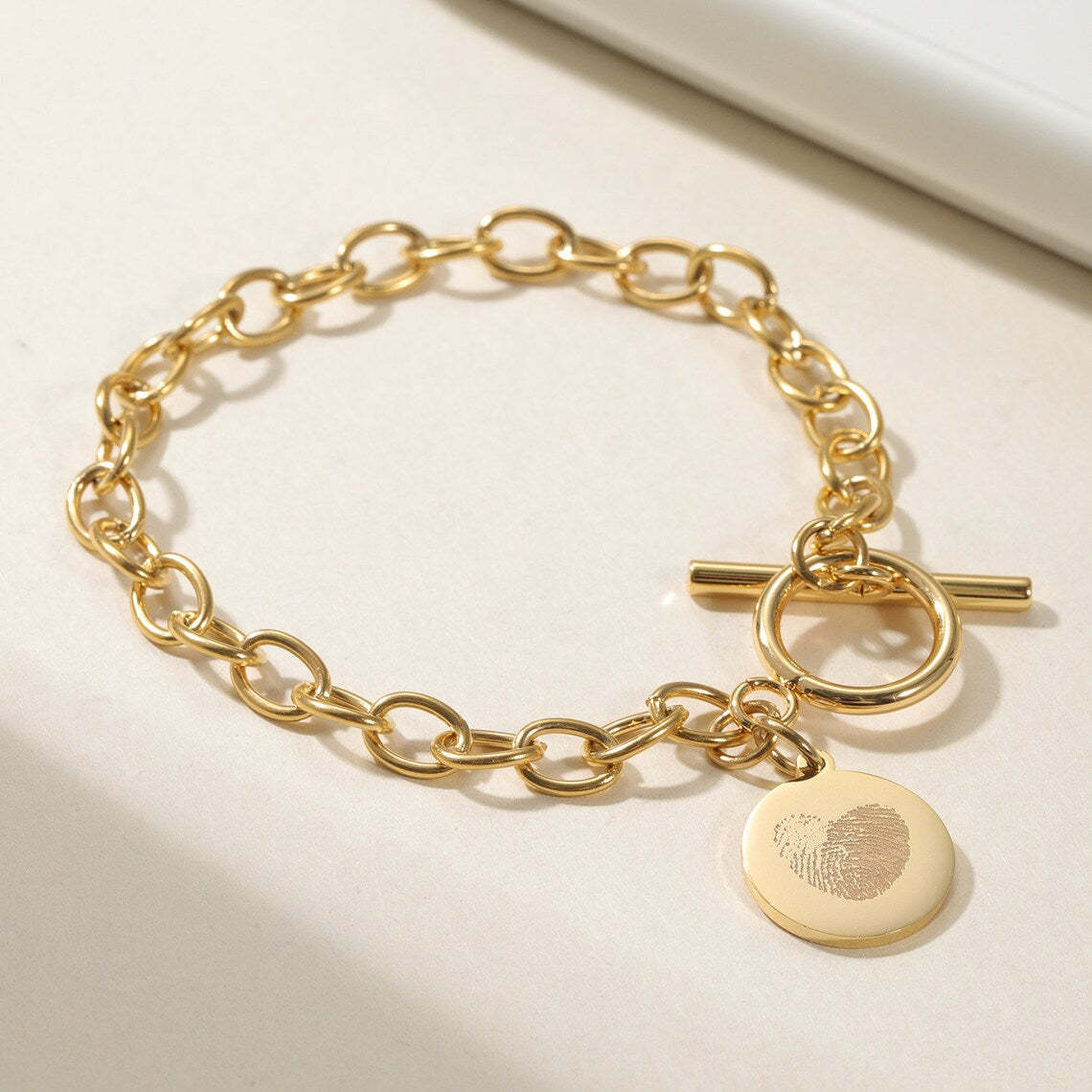 Cherish Life's Moments - Gold-Tone Fingerprint Bracelet, a Personal Touch. #FingerprintBracelet #GoldJewelry #PersonalizedGift