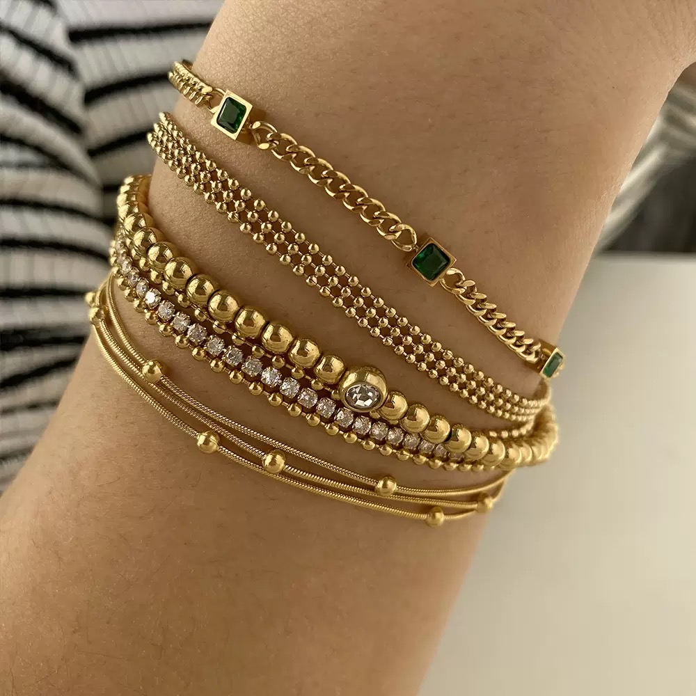Gold-plated bracelet, emerald gemstones, women's jewelry, fashion accessory, luxury bracelet