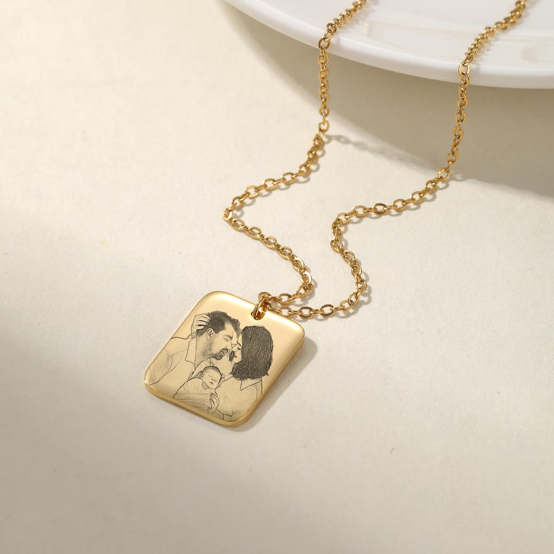 Wear Your Family Close to Your Heart - Custom Engraved Gold Family Portrait Necklace. #FamilyPortraitNecklace #GoldEngravedJewelry #CustomFamilyGift